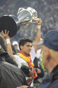 Fredy Montero raises the Open Cup trophy amidst the post-game celebrations