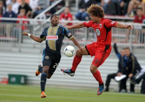 2012 US Open Cup: Nick DeLeon (18) of DC United pulls the ball away from Raymon Gaddis (28) of the Philadelphia Union during a US Soccer Open Cup match at the Maryland Soccerplex. Photo: Tony Quinn | DC United