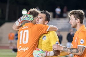 Fabian Cerda of the Tulsa Roughnecks (yellow) gets a hug from a teammate prior to the team's penalty kick shootout against San Antonio FC in the Third Round of the 2017 US Open Cup. Credit: Lori Scholl