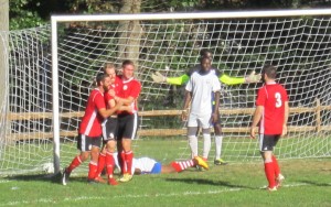 United German Hungarians (red) celebrate a goal by John Gravelle against the Junior Lone Star U-23s in a 2018 US Open Cup qualifying match. Photo: Kari Berton