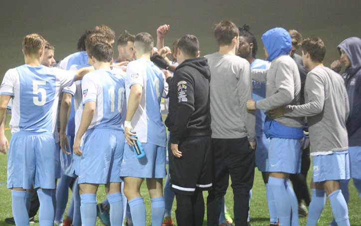 The Seacoast Phantoms huddle up during their match against the Kendall Wanderers in the 2018 US Open Cup. Photo: Ashley MacLaughlin | Seacoast United Phantoms