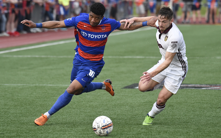 Emery Welshman of FC Cincinnati battles for the ball with a Detroit City FC player in a Second Round match in the 2018 US Open Cup. Photo: Brett Hansbauer | 4th Floor Creative