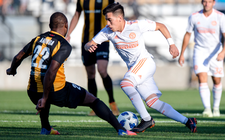 Ezequiel Barco of Atlanta United dribbles past a Charleston Battery defender in the 2018 US Open Cup. Photo: Eric Rossitch | Atlanta United
