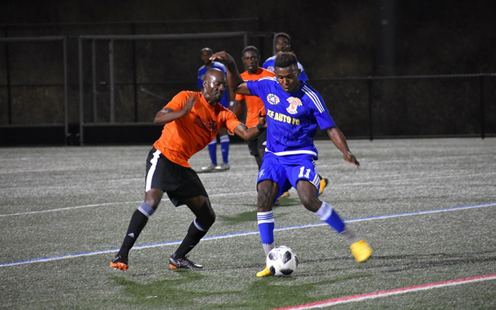 Players from World Class Premier (orange) and Izee Auto FC battle for the ball in a 2019 US Open Cup qualifying match. Photo: Sean Maslin