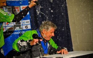 Sigi Schmid of the Seattle Sounders FC is showered with champagne during his post-game preference after winning the 2010 Lamar Hunt US Open Cup championship.
