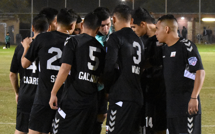 Cal FC players huddle up prior to their 2020 US Open Cup qualifier against Oxnard Guerreros. Photo: Victor Friedman | Cal FC