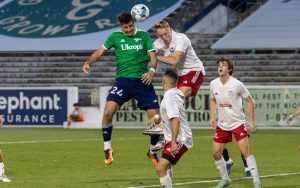 Players from the Richmond Kickers (green) and North Carolina Fusion U-23s go up for a header in the Third Round of the 2022 US Open Cup. Photo: Jessica Stone Hendricks Photography