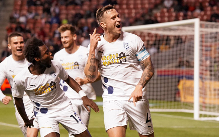 Robert Cornwall of Northern Colorado Hailstorm FC celebrates with his teammates after scoring a goal against Real Salt Lake in the Third Round of the 2022 US Open Cup. Photo: Ashley Potts | Northern Colorado Hailstorm FC
