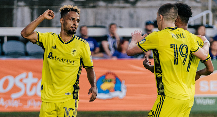 Hany Mukhtar of Nashville SC (left) celebrates with his teammates after scoring a goal in the 89th minute against Louisville City in the 2022 US Open Cup. Photo: Nashville SC