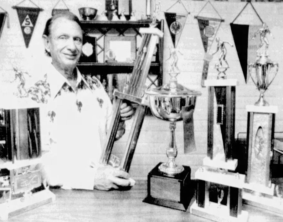 St. Petersburg Kickers founder Kirk Herbach with many of the trophies his club has won in an early 80s photo from the St. Petersburgh Times archive.