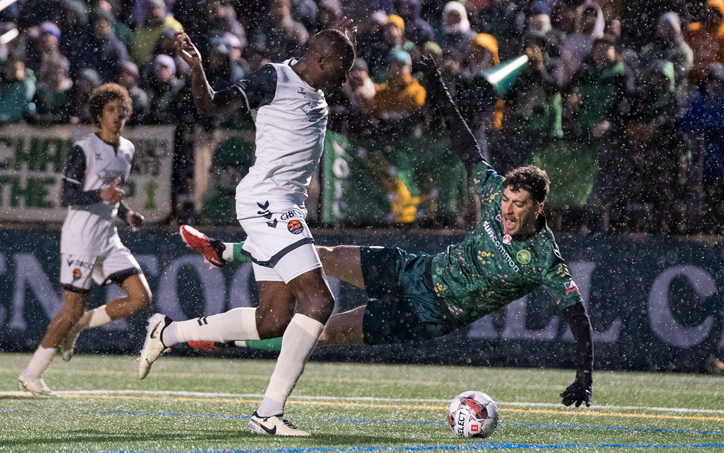Players from Carolina Core FC (left) and Vermont Green FC battle for the ball in a Second Round game in the 2024 US Open Cup. Photo: Josh Wallace | Vermont Green FC
