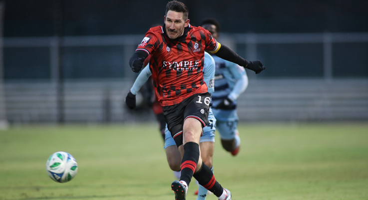 Sacha Kljestan of the Des Moines Menace strikes a ball against Sporting KC II in the First Round of the 2025 US Open Cup. Photo: Des Moines Menace