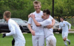 Craig Bebee of Livonia City FC celebrates with his teammates after scoring the first goal in team history during the 2016 season. Photo: Dan Garnell
