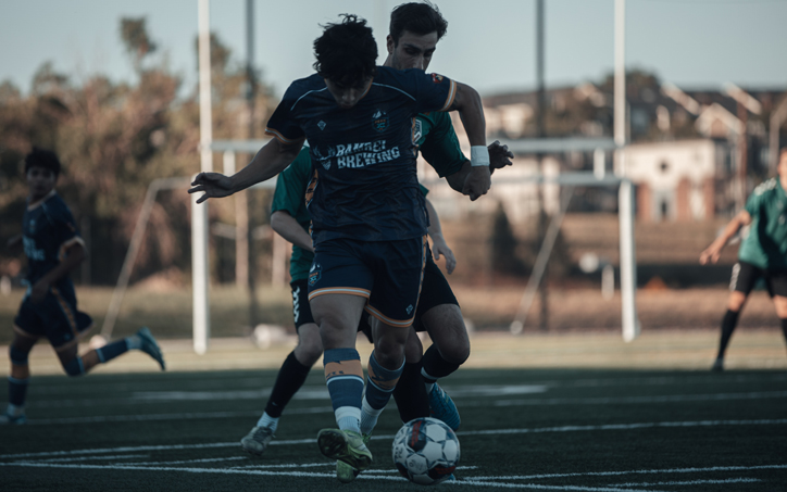 Players from Peak Eleven (foreground) and FC Denver battle for the ball in the First Round of the 2026 US Open Cup qualifying tournament. Photo: Brian Martagon De La Rosa (11_brian_mdlr on IG) with DT Sports (DTSportsTV on IG)
