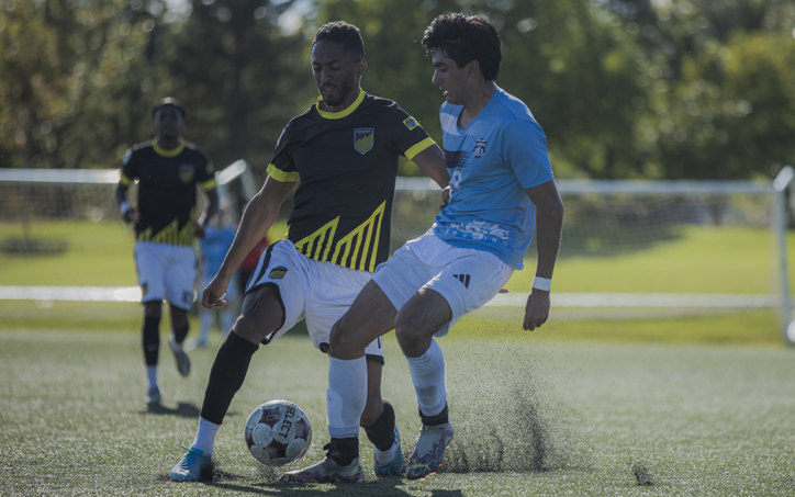 Players from Boulder United (left) and the Colorado Rovers battle for the ball in the First Round of the 2026 US Open Cup qualifying tournament. Photo: Boulder United